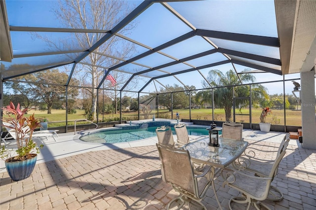 view of swimming pool featuring a lanai and a patio