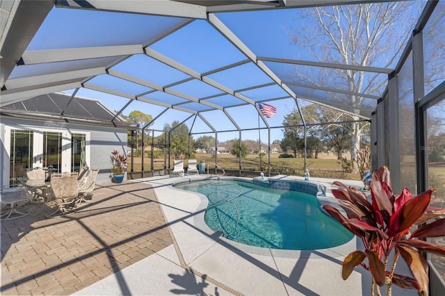 view of pool with a lanai and a patio area