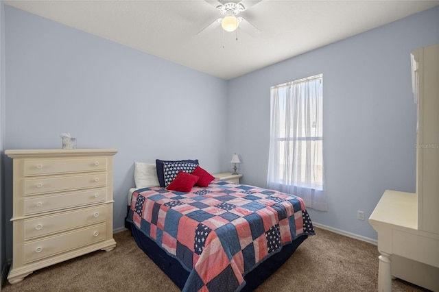 bedroom featuring ceiling fan and carpet