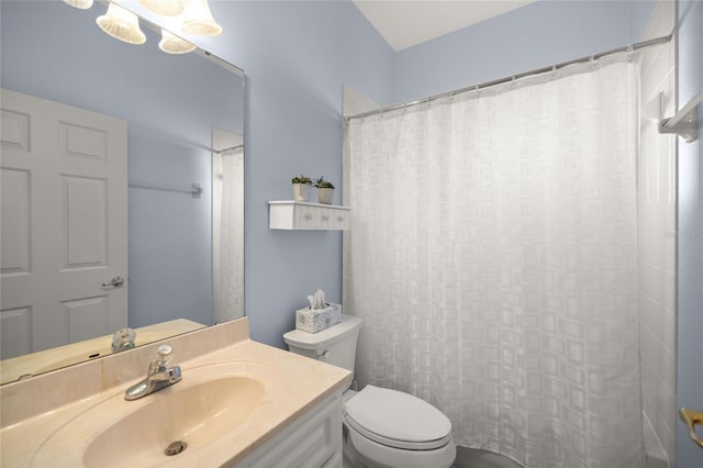 bathroom with toilet and vanity