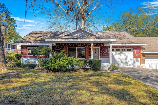 ranch-style house featuring a front lawn and a garage