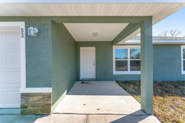 property entrance with a garage