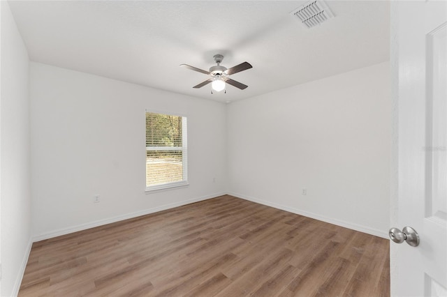 unfurnished room featuring ceiling fan and light hardwood / wood-style floors