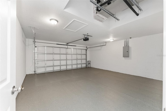 garage featuring electric panel and a garage door opener