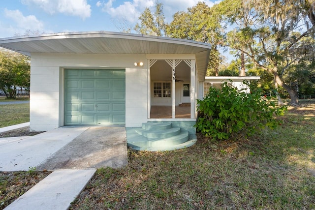 exterior space featuring an outbuilding and a garage