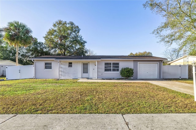 ranch-style home with a front yard and a garage