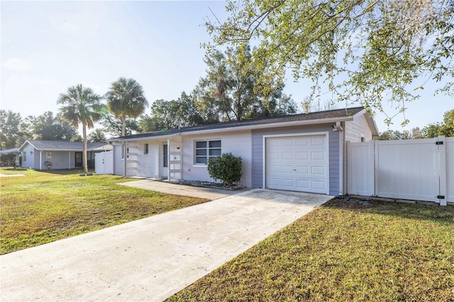 single story home with a front yard and a garage