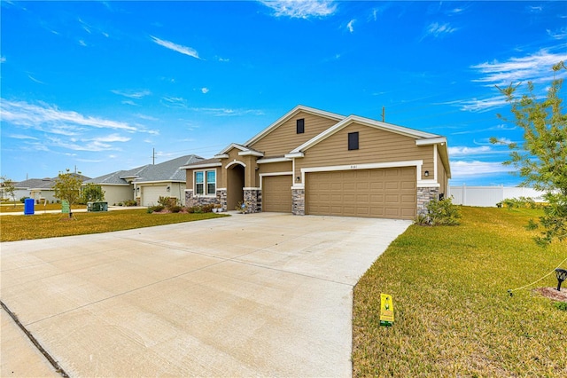 view of front of property featuring a front lawn and a garage