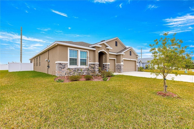 view of front of house featuring a front yard and a garage