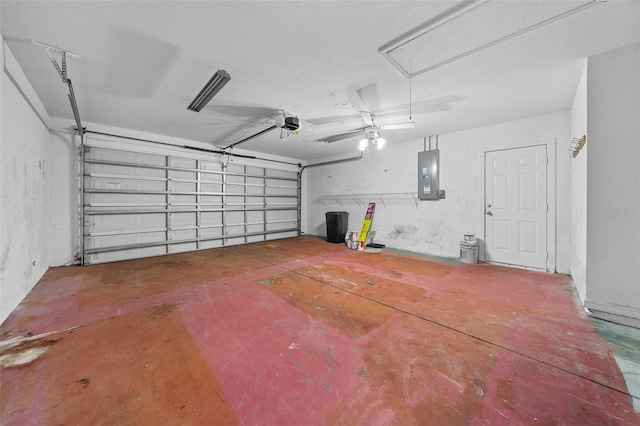 garage with electric panel and a garage door opener