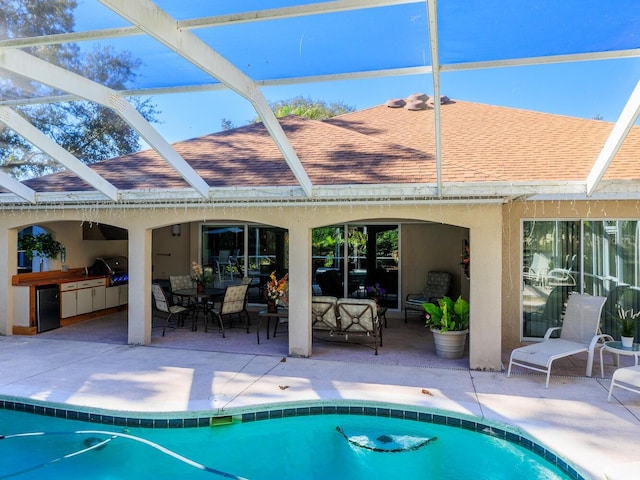 view of pool with a patio area, an outdoor living space, area for grilling, and a grill