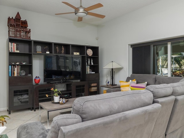 tiled living room featuring a textured ceiling and ceiling fan