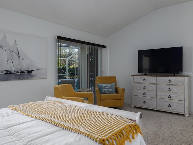 bedroom with carpet flooring and vaulted ceiling