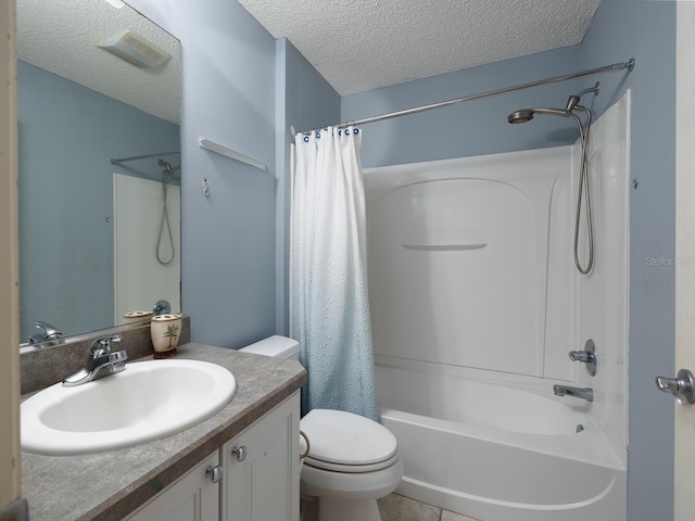 full bathroom featuring toilet, vanity, a textured ceiling, and shower / tub combo with curtain