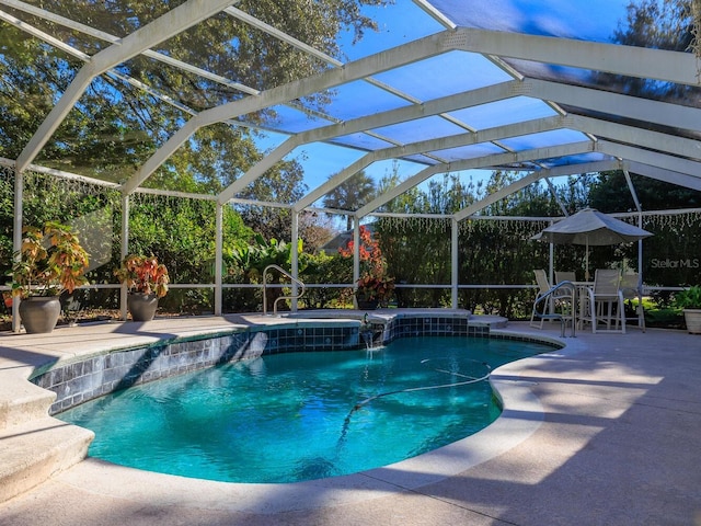 view of pool featuring a lanai, a patio, and pool water feature