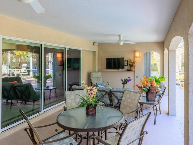 sunroom / solarium with ceiling fan