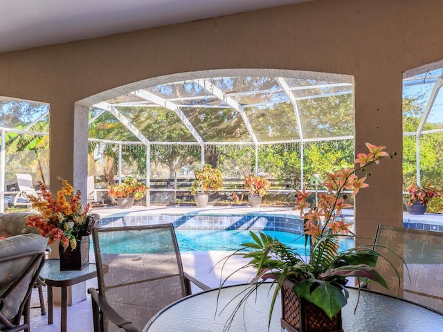 view of pool with a lanai and a patio area