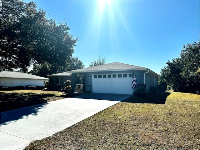 single story home featuring a front yard and a garage