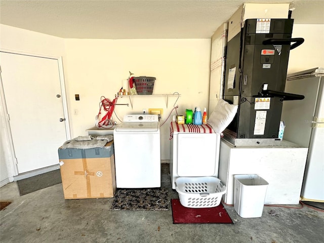 laundry room featuring separate washer and dryer and heating unit