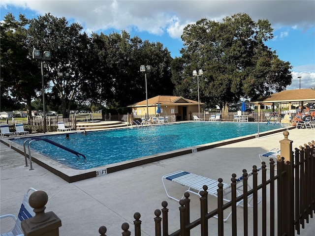 view of swimming pool with a patio area