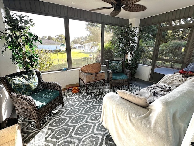 sunroom / solarium with ceiling fan