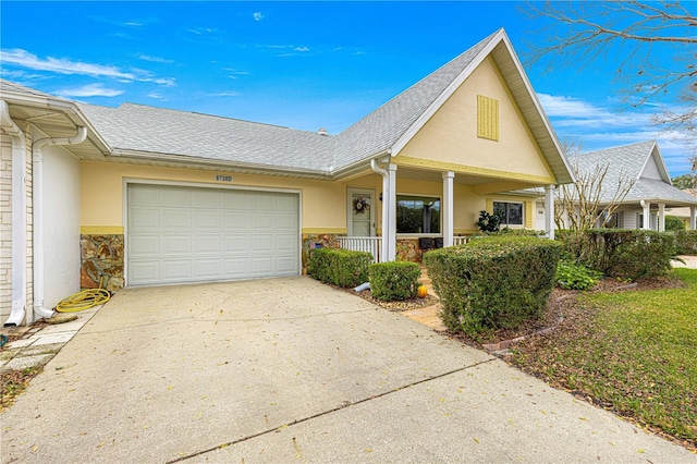 view of front of house with a porch and a garage