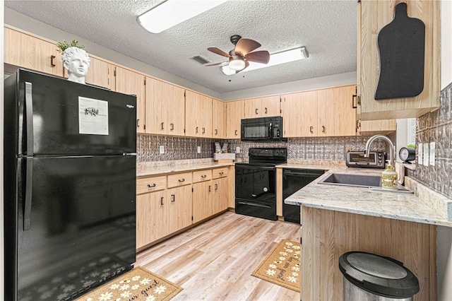 kitchen featuring ceiling fan, black appliances, sink, a textured ceiling, and light brown cabinetry