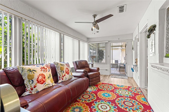 sunroom / solarium with ceiling fan