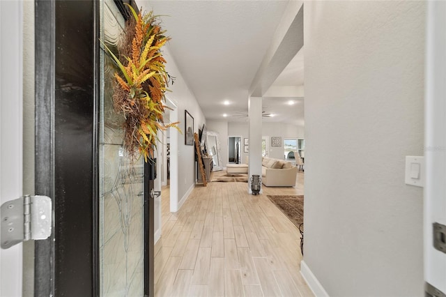 corridor featuring light hardwood / wood-style flooring