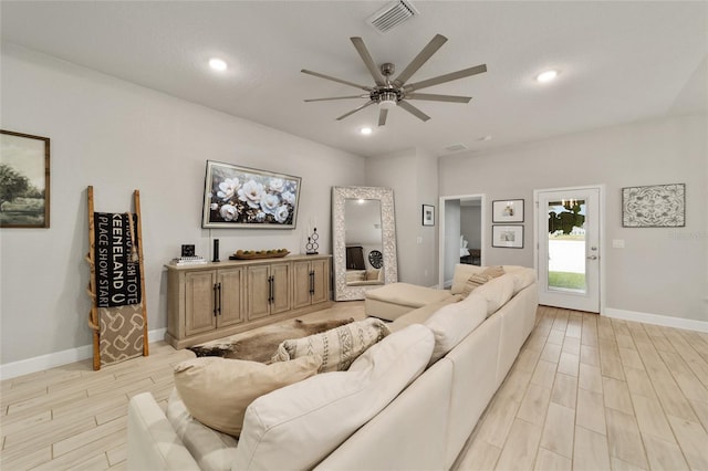 living room featuring ceiling fan