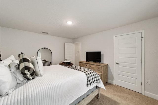 bedroom featuring light colored carpet