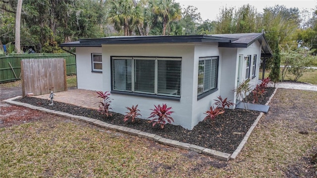 view of side of home featuring a patio area