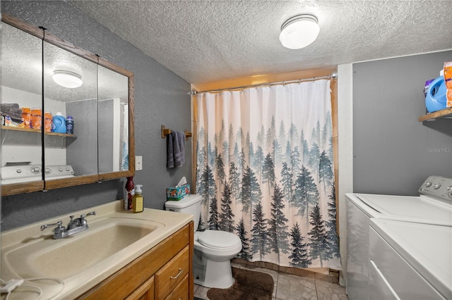 bathroom featuring toilet, a textured ceiling, curtained shower, separate washer and dryer, and vanity