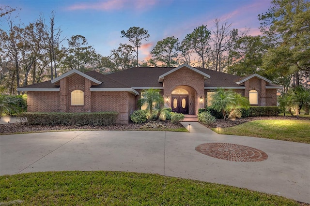 ranch-style house with a yard