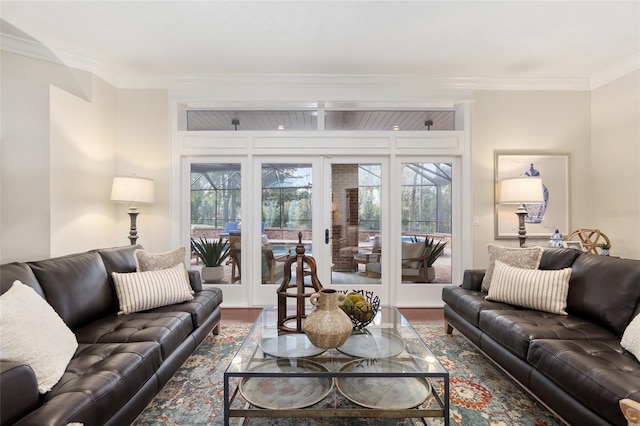 living room featuring wood-type flooring, ornamental molding, and french doors