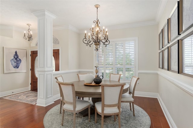 dining space featuring ornate columns, ornamental molding, dark wood-type flooring, and a chandelier