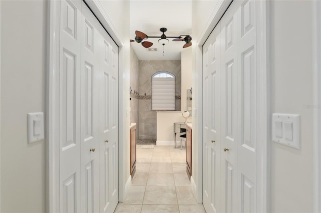 corridor with light tile patterned floors