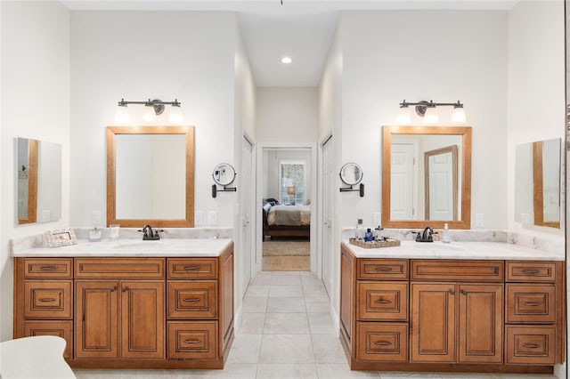 bathroom with tile patterned flooring and vanity