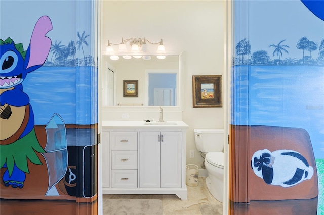 bathroom featuring vanity and toilet