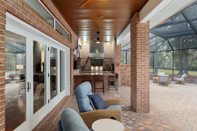 view of patio / terrace featuring outdoor lounge area, french doors, and exterior bar