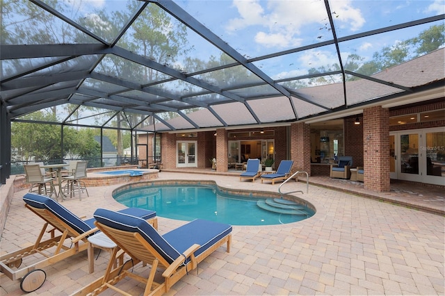 view of swimming pool featuring an in ground hot tub, glass enclosure, a patio area, and french doors