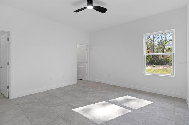 unfurnished room featuring ceiling fan and a healthy amount of sunlight