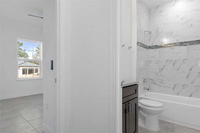 full bathroom with tile patterned flooring, tiled shower / bath combo, vanity, and toilet