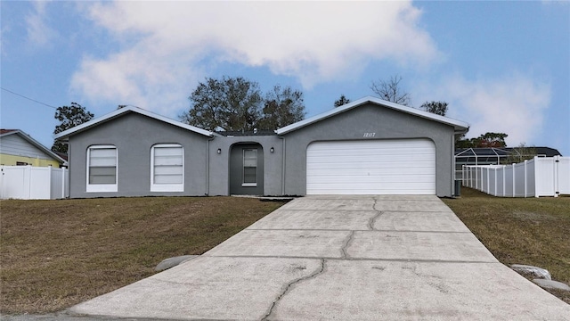 ranch-style home with a garage and a front yard