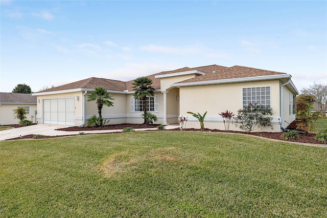 single story home with a front yard and a garage