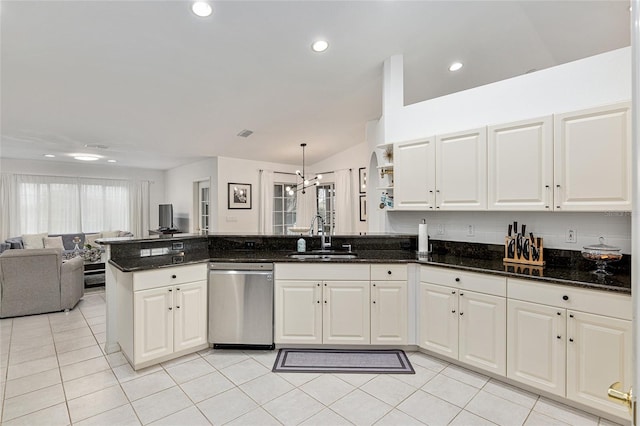 kitchen with sink, decorative light fixtures, white cabinets, dishwasher, and dark stone counters