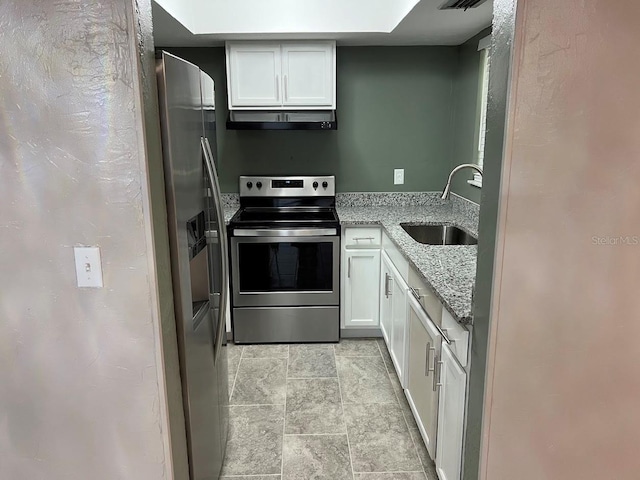 kitchen featuring range hood, light stone countertops, stainless steel appliances, white cabinetry, and sink