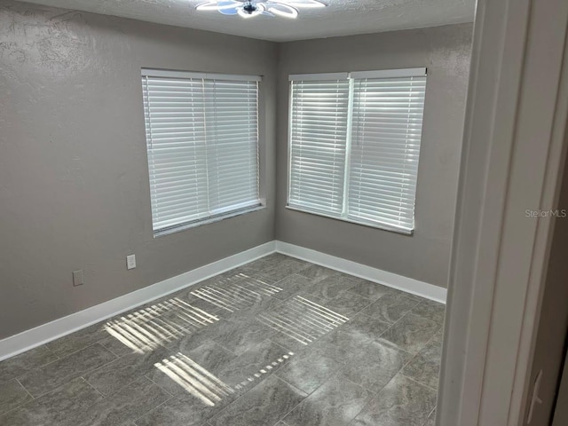 spare room featuring ceiling fan