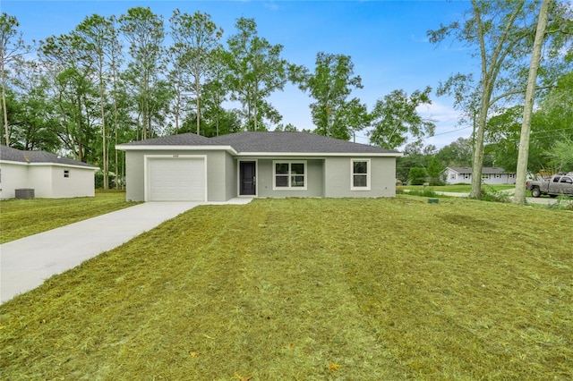 ranch-style house with a garage, cooling unit, and a front yard