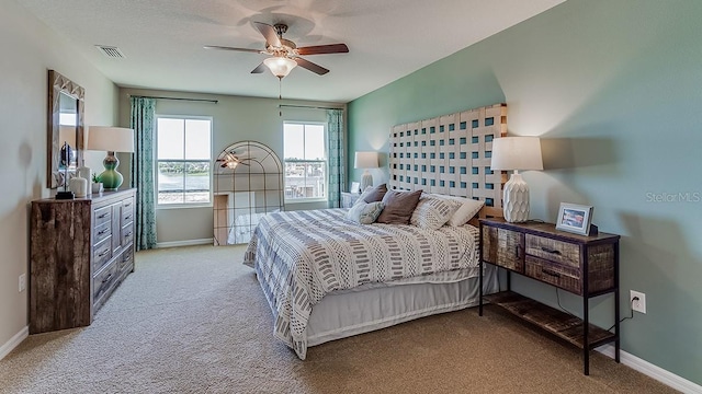 bedroom with light carpet and ceiling fan